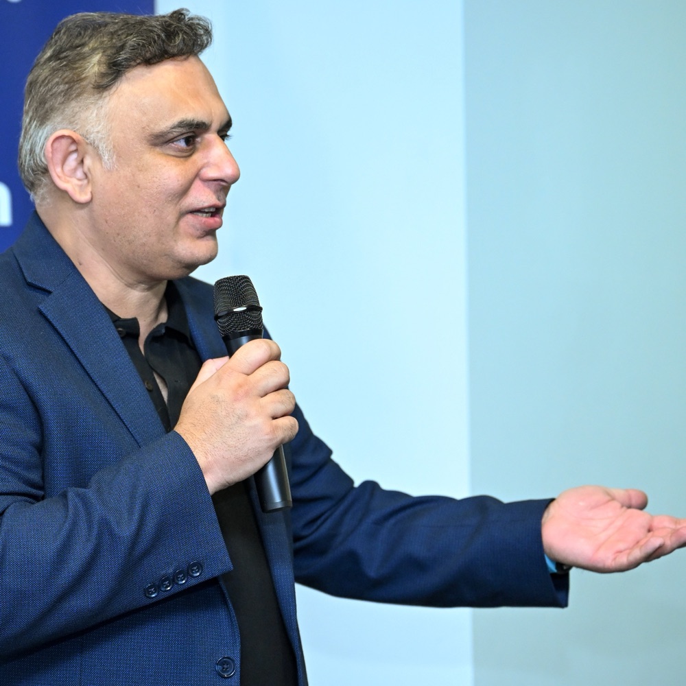 Amad Malik speaking at an aviation industry event